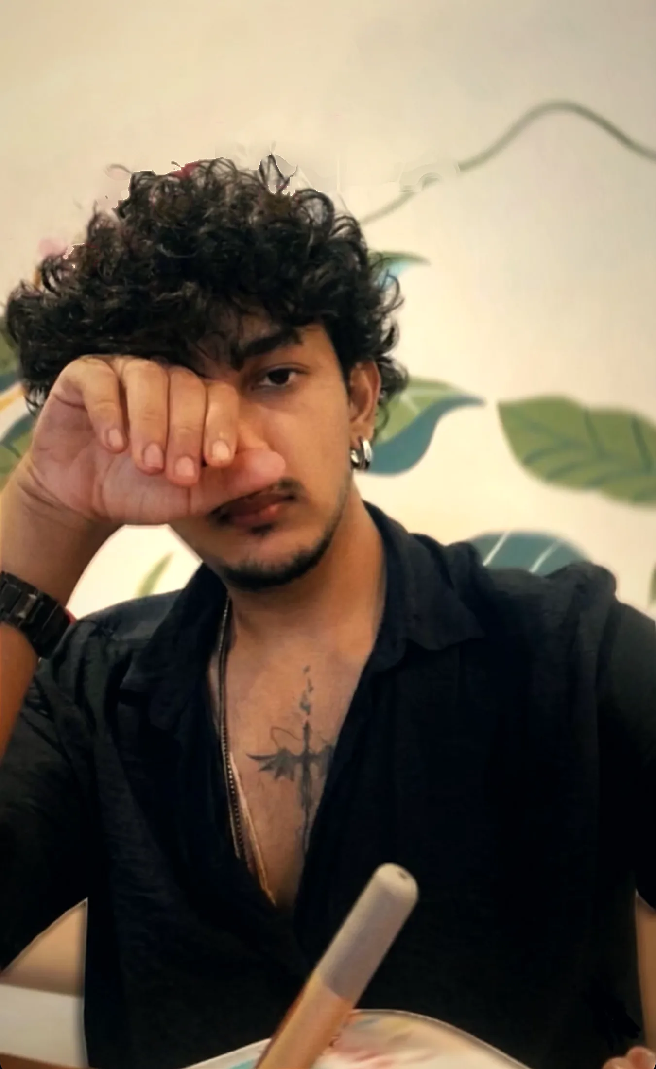 Portrait, one hand over his eye