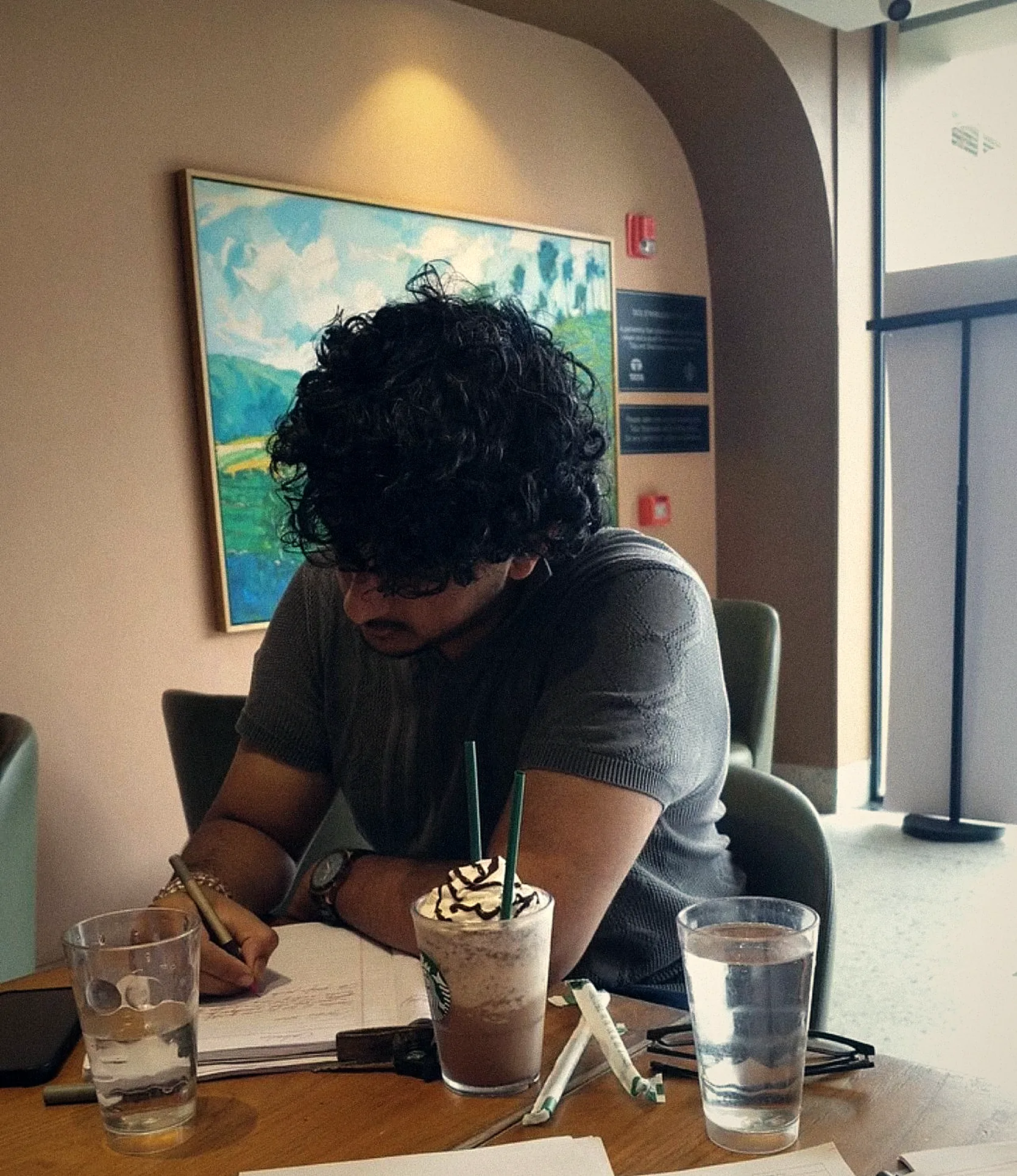 Working through notes at a café
